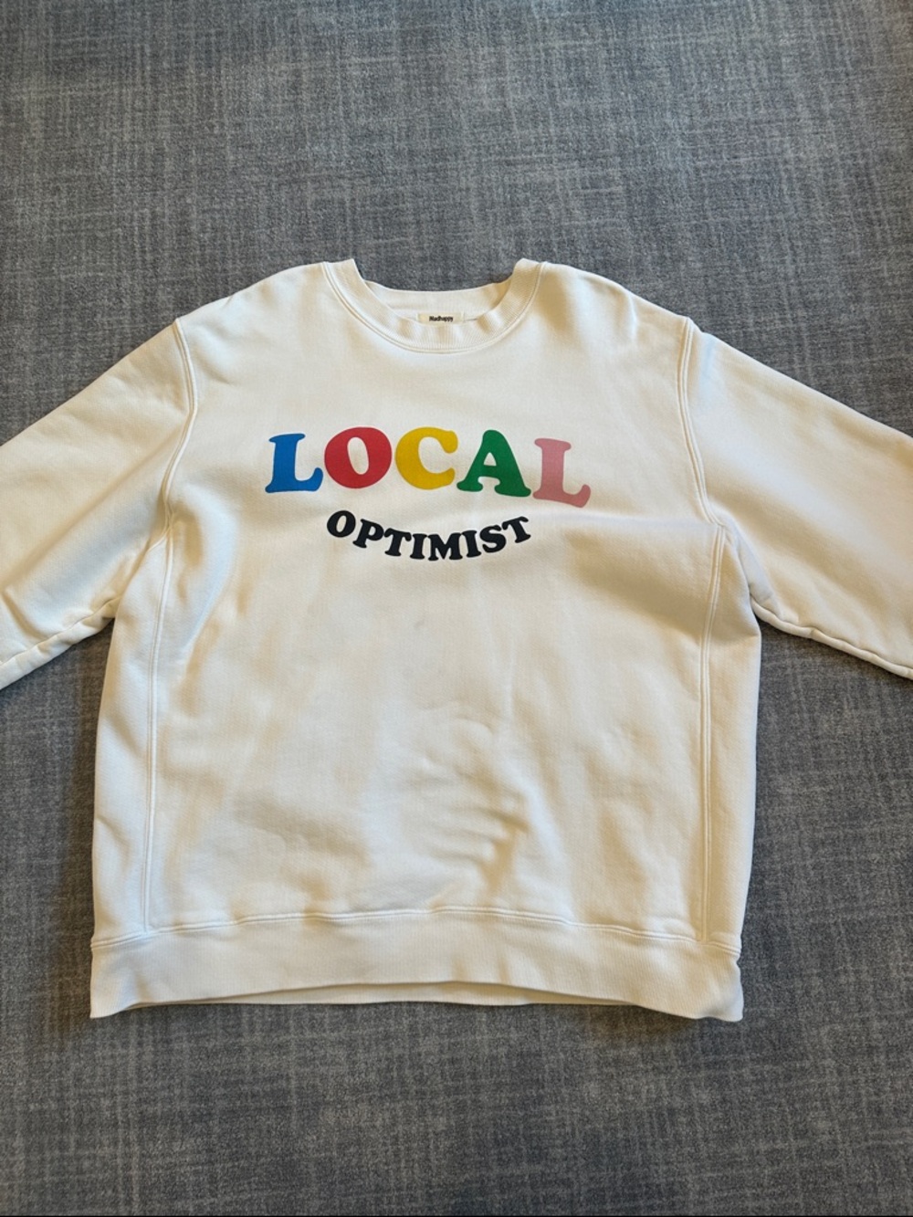 Madhappy Cream Crewneck With The Writing “Local Optimist”